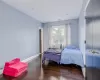 Bedroom with dark wood-type flooring