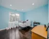 Bedroom with dark wood-type flooring