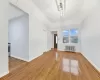 Empty room with hardwood / wood-style floors and radiator