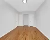 Empty room with light hardwood / wood-style flooring