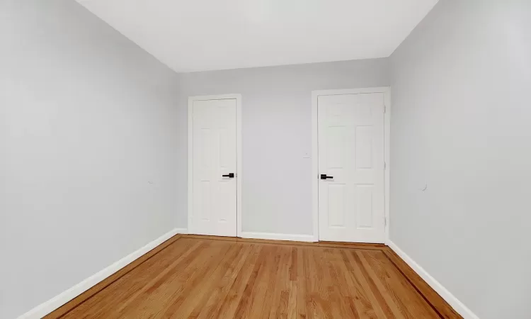 Spare room featuring hardwood / wood-style flooring