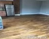 Kitchen featuring white fridge and dark hardwood / wood-style floors