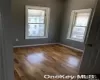 Unfurnished room with hardwood / wood-style flooring