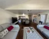 Living room with wood-type flooring and lofted ceiling