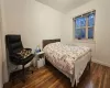 Bedroom featuring dark hardwood / wood-style floors