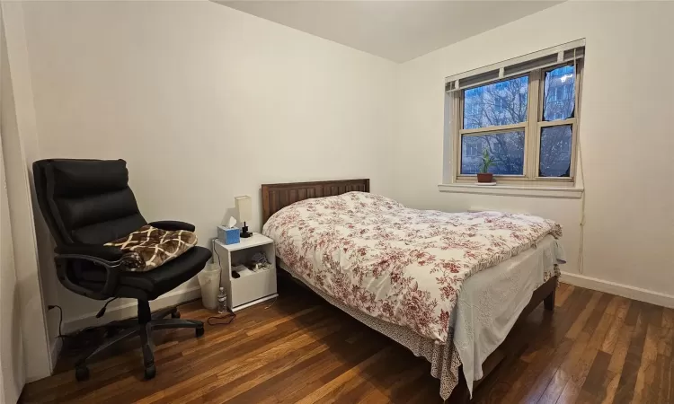 Bedroom featuring dark hardwood / wood-style floors