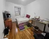 Bedroom featuring dark hardwood / wood-style flooring