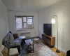 Living room featuring hardwood / wood-style floors and radiator heating unit