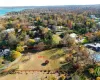 Birds eye view of property with a water view