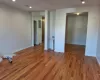 Empty room with wood-type flooring and sink