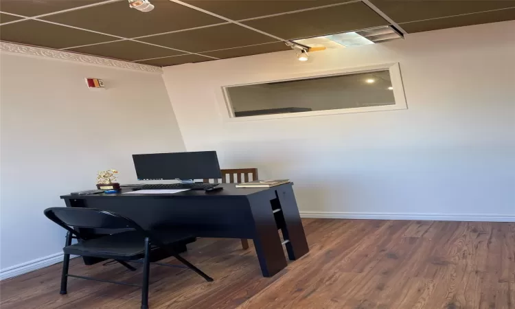 Office area featuring dark hardwood / wood-style flooring