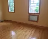 Unfurnished room with light hardwood / wood-style floors and baseboard heating