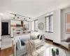 Living room featuring light hardwood / wood-style flooring and sink