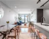 Dining area featuring light hardwood / wood-style floors, sink, and a wall mounted air conditioner