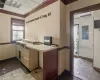 Kitchen with ornamental molding and electric panel