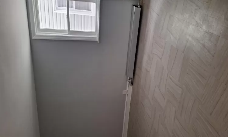 Spare room with baseboard heating