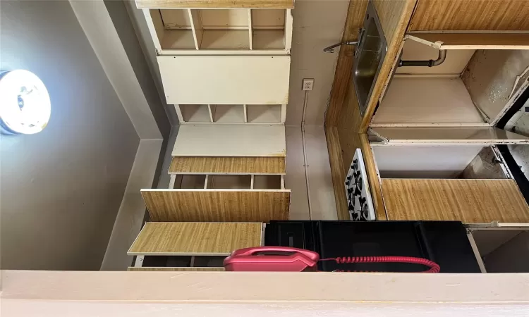 Kitchen with wall oven, cooktop, and sink