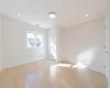 Unfurnished room featuring light wood-type flooring