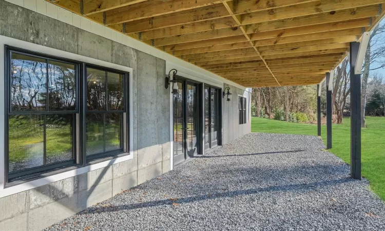 View of under the deck / terrace. Basement windows