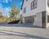 View of property exterior featuring a garage