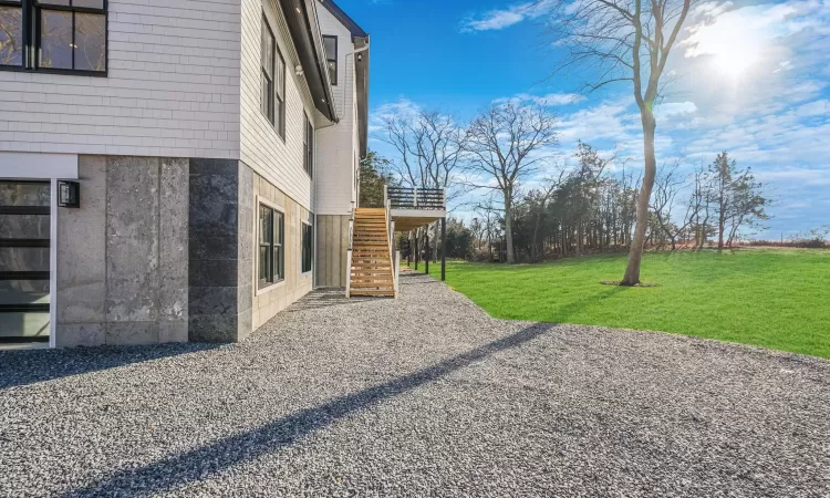 View of yard with a wooden deck