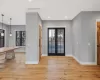 Entryway with french doors, light hardwood / white oak flooring, and a wealth of natural light