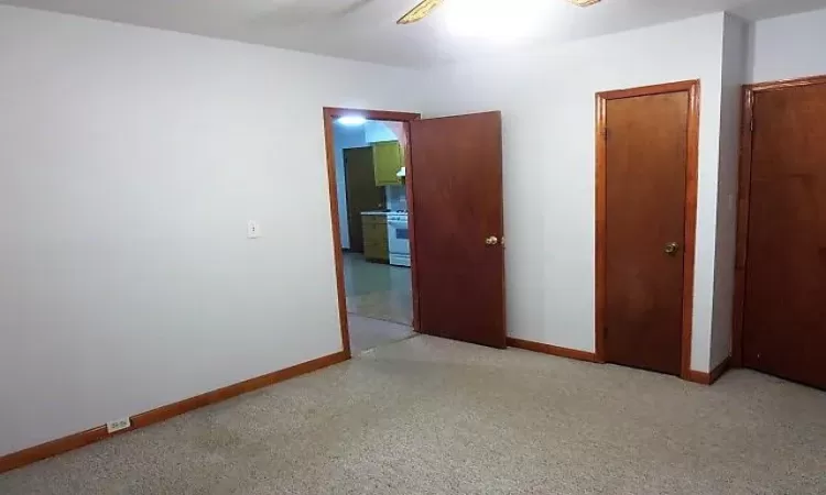 Unfurnished bedroom featuring ceiling fan