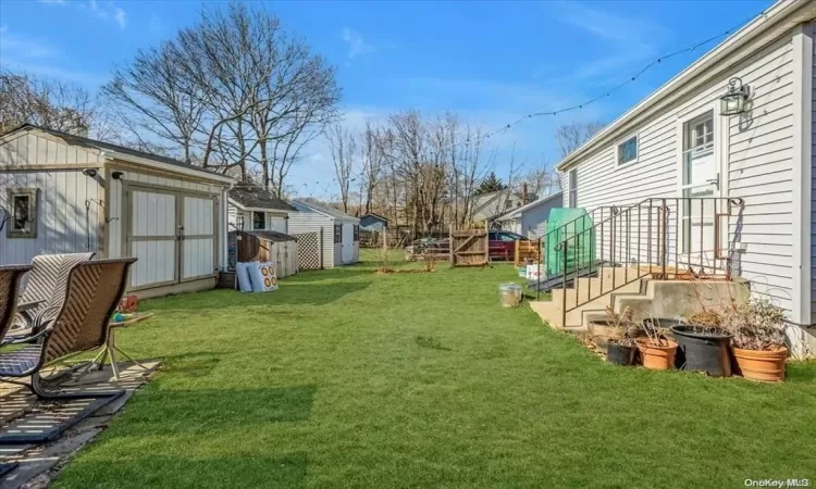 View of yard with a storage shed