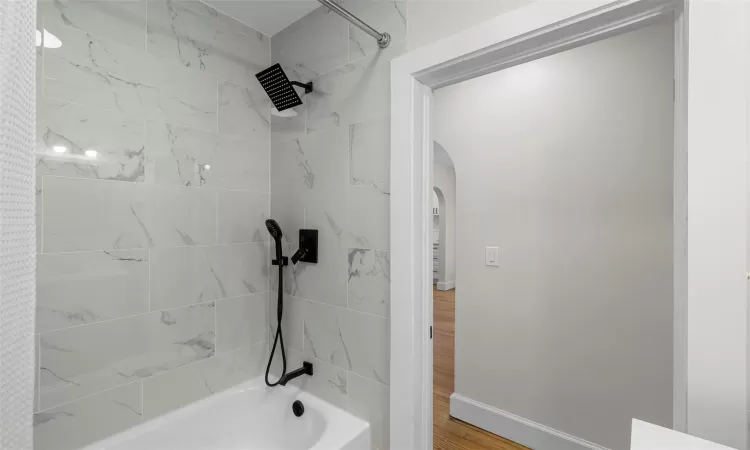 Fully renovated bathroom - tub and shower.