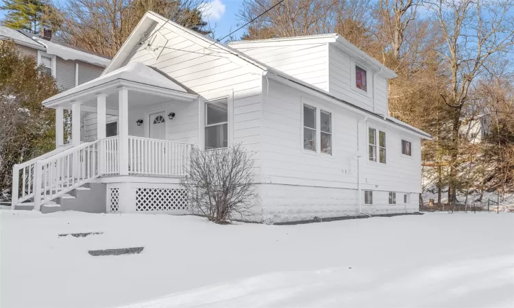 View of front of house with covered porch