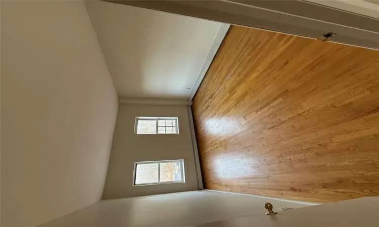 Empty room featuring light hardwood / wood-style flooring and a baseboard heating unit