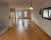 Empty room featuring baseboard heating and light hardwood / wood-style flooring