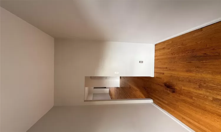 Spare room with hardwood / wood-style flooring