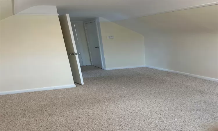 Unfurnished room with light colored carpet