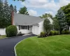 View of front of home featuring a garage and a front lawn