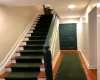 Staircase with hardwood / wood-style flooring