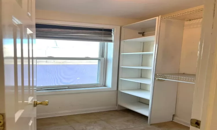 Bright closet with lots of shelves