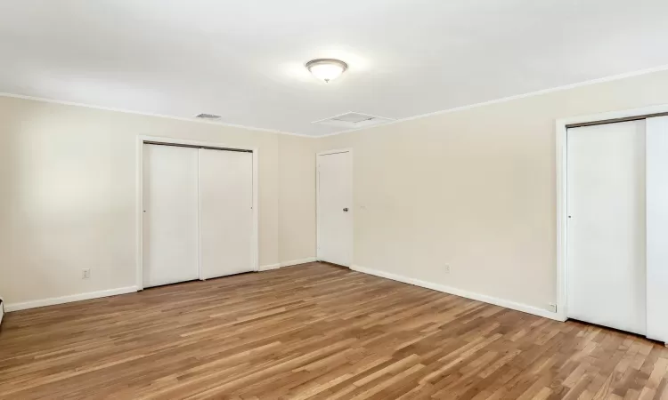 Kitchen with a chandelier, a healthy amount of sunlight, light wood-type flooring, and a baseboard heating unit