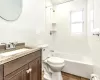 Basement featuring a drop ceiling and a baseboard radiator