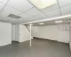 Unfurnished bedroom featuring a closet, light hardwood / wood-style flooring, and a baseboard heating unit