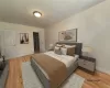 Bedroom with light hardwood / wood-style flooring