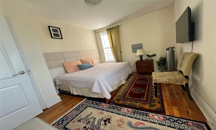 Bedroom featuring hardwood / wood-style floors