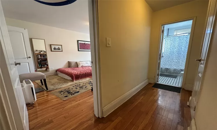 Bedroom with dark wood-type flooring