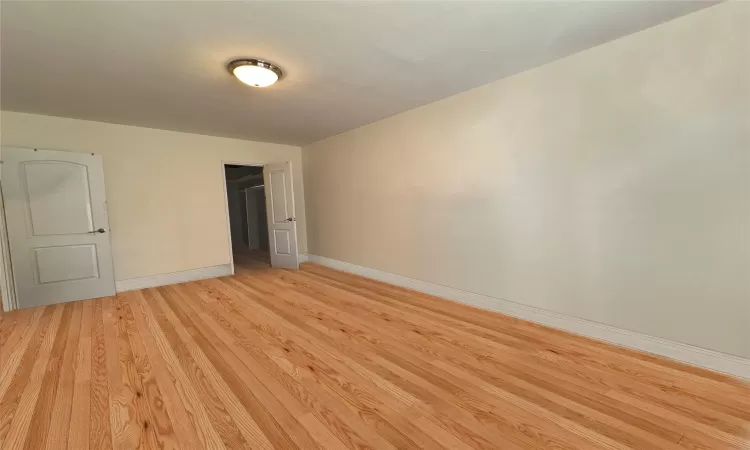 Doorway with hardwood / wood-style flooring