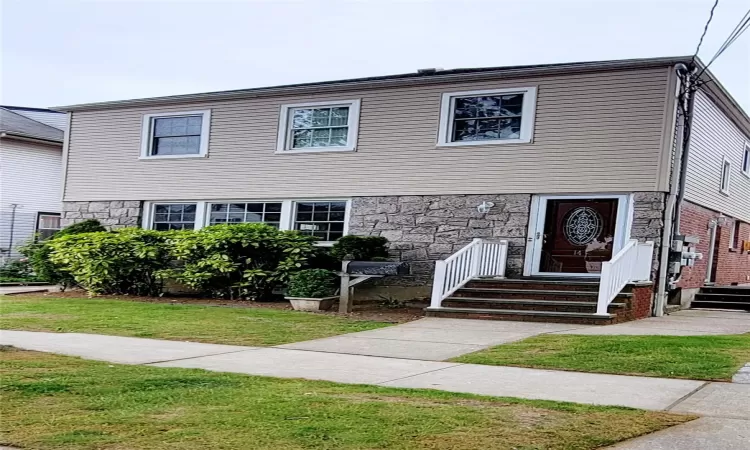 View of front of home with a front yard