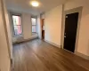 Unfurnished room with radiator heating unit and hardwood / wood-style flooring