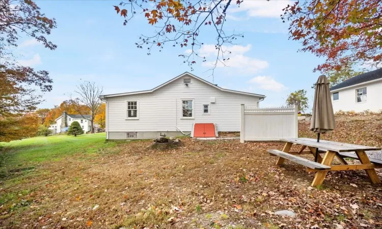 Back of house featuring a lawn