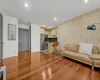 Living room featuring sink and light wood-type flooring