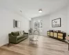 Living room with light hardwood / wood-style floors