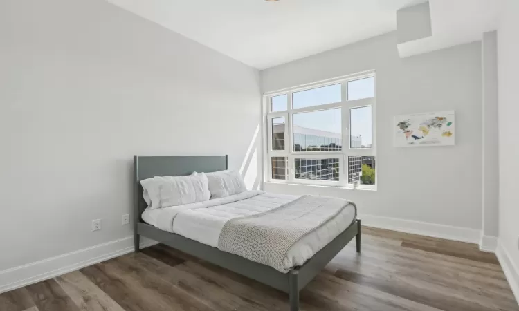 Bedroom featuring dark hardwood / wood-style floors